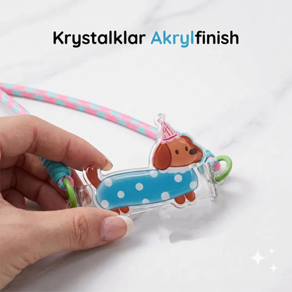 Telefonclips med tegnehjulsdyr og håndledsrem